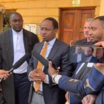 Norwegian investor John B. Solheim addresses the media outside Milimani Law Courts