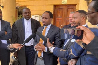 Norwegian investor John B. Solheim addresses the media outside Milimani Law Courts